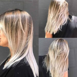 Mujer con puntas rubias y pelo liso de Peluqueros de Moda